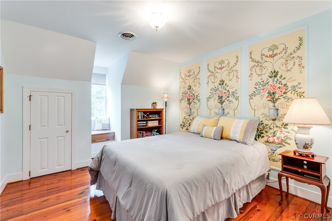 1290 Johns Road Carson, VA 23830 - Photo 33 of 48 a bedroom with a bed and a lamp on dresser