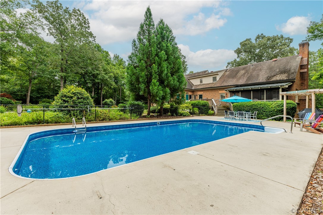 1290 Johns Road Carson, VA 23830 - Photo 40 of 48 a view of backyard with swimming pool and outdoor seating