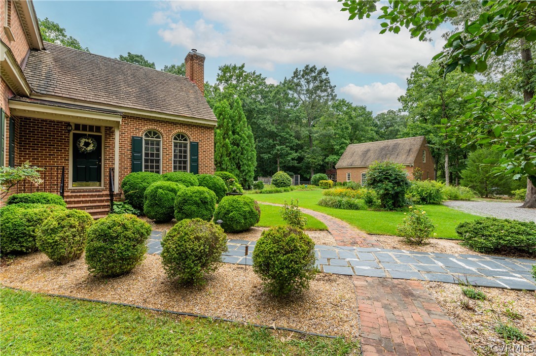 1290 Johns Road Carson, VA 23830 - Photo 41 of 48 a front view of a house with a yard and outdoor seating