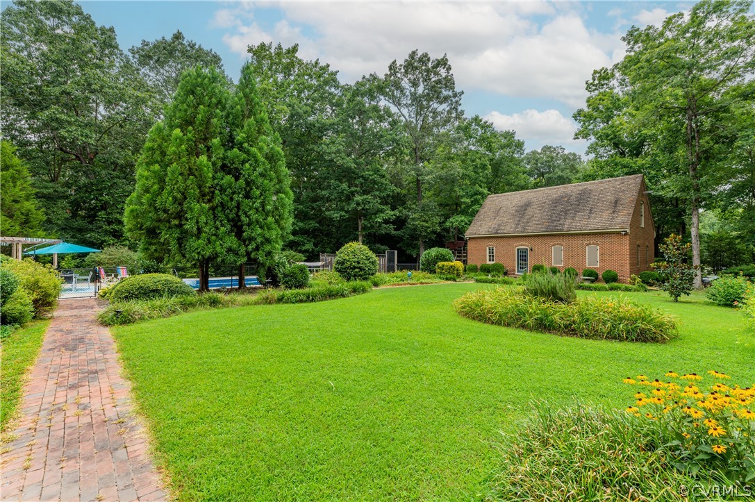 1290 Johns Road Carson, VA 23830 - Photo 42 of 48 a view of a garden with a house
