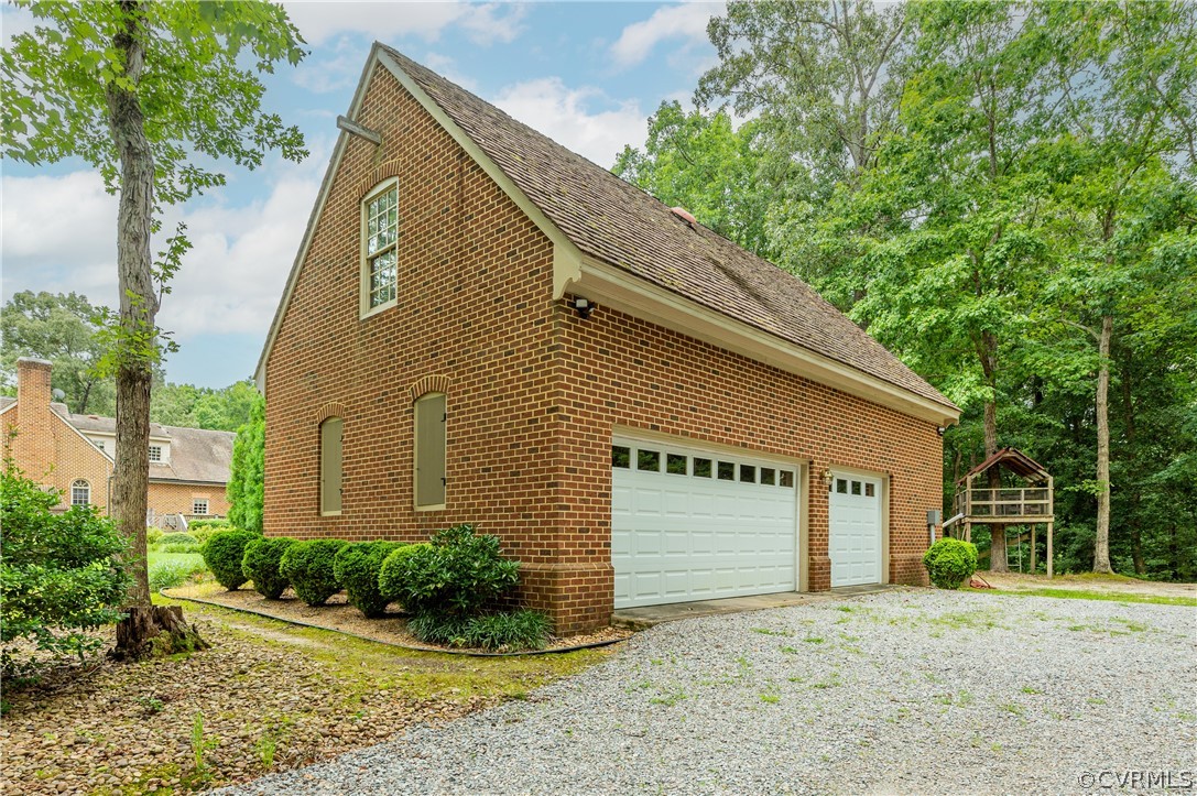 1290 Johns Road Carson, VA 23830 - Photo 45 of 48 a view of a house with a yard and potted plants
