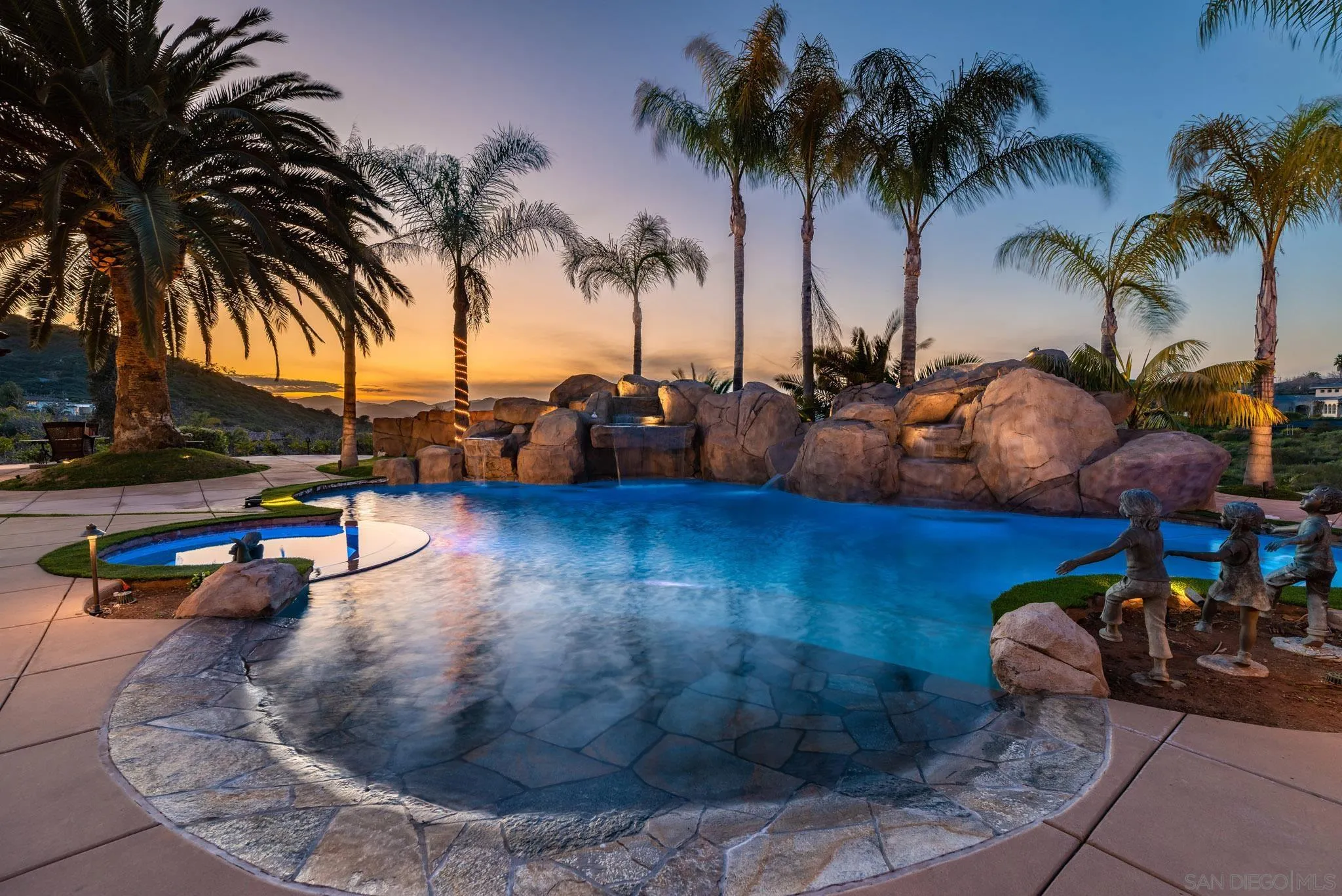 a view of a swimming pool with a table and chairs