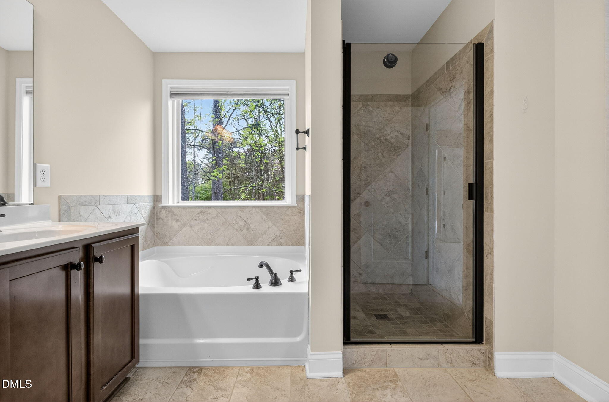 1304 Barnford Mill Road Wake Forest, NC 27587 - Photo 29 of 44 a bathroom with a bathtub and a sink