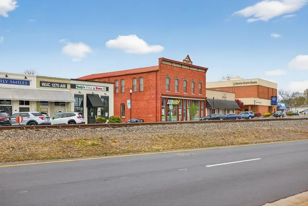 a view of a food mall next to a building