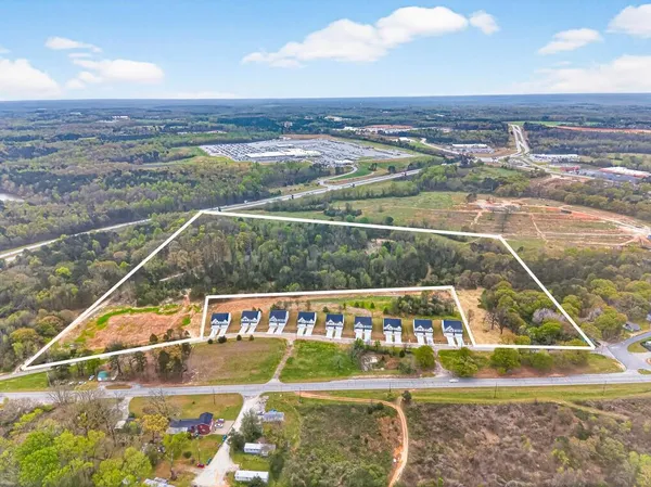 a view of a swimming pool with an outdoor seating