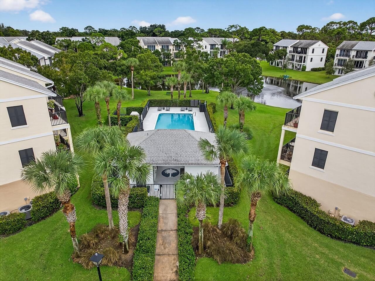 1685 42nd Square, Unit 101 Vero Beach, FL 32960 - Photo 26 of 37 aerial view of a house with a garden