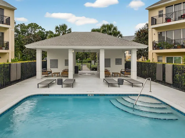 a view of a house with patio and a yard