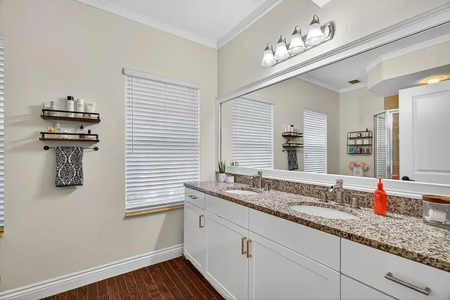 a bathroom with a sink and a window