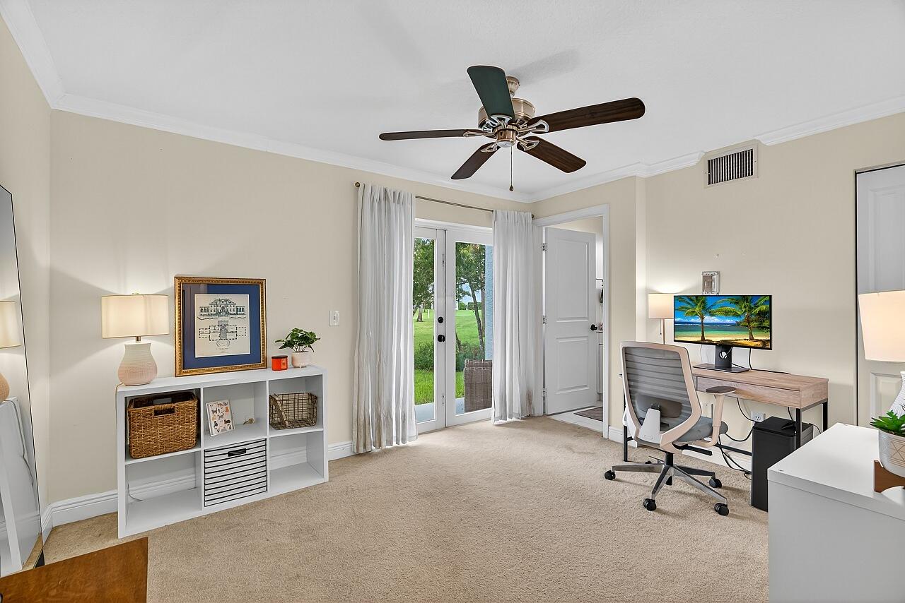 1685 42nd Square, Unit 101 Vero Beach, FL 32960 - Photo 6 of 37 a view of a livingroom with a workspace