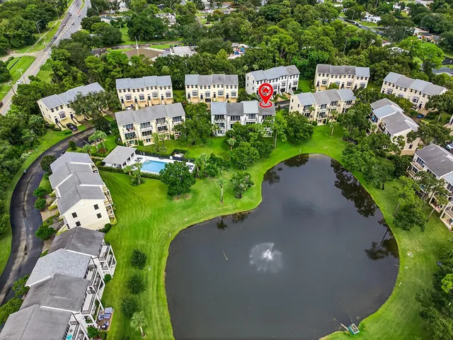 a sign that is sitting in front of flowers