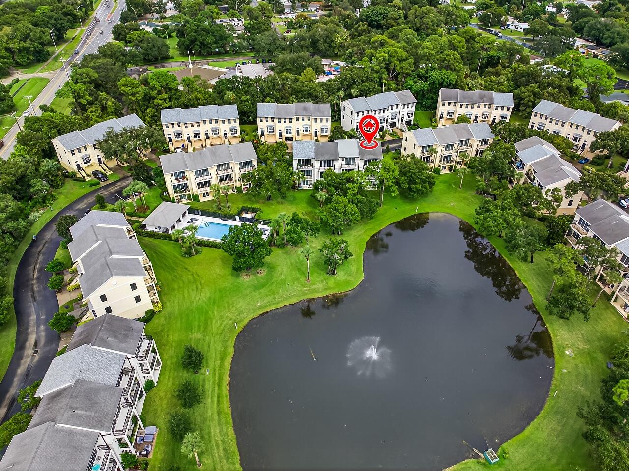 1685 42nd Square, Unit 101 Vero Beach, FL 32960 - Photo 8 of 37 a sign that is sitting in front of flowers