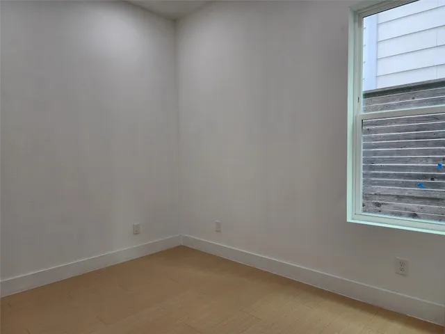a kitchen with a sink appliances and cabinets