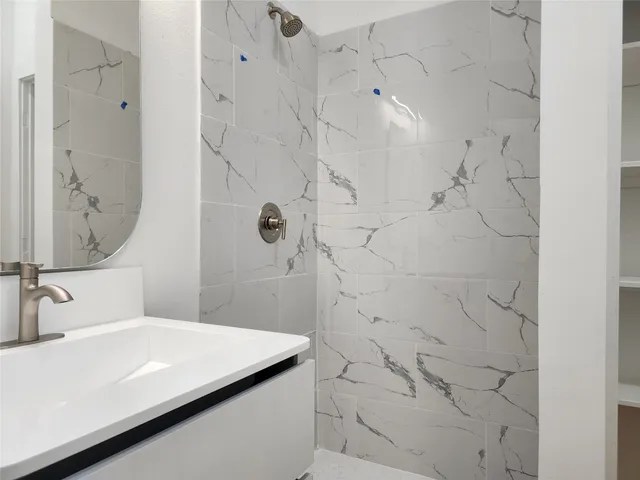 a view of an empty room with stairs