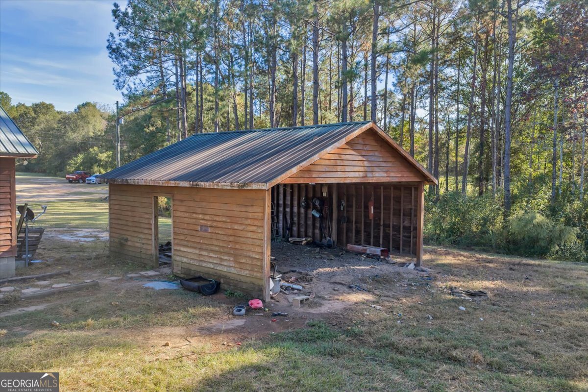 874 Mistletoe Road Abbeville, GA 31001 - Photo 12 of 67 a front view of a house with a yard
