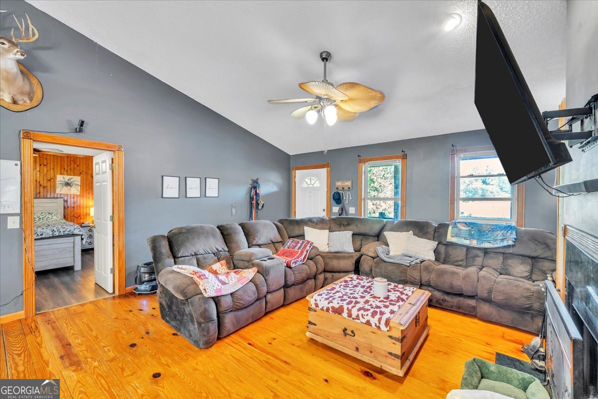 874 Mistletoe Road Abbeville, GA 31001 - Photo 18 of 67 a living room with furniture and a large window