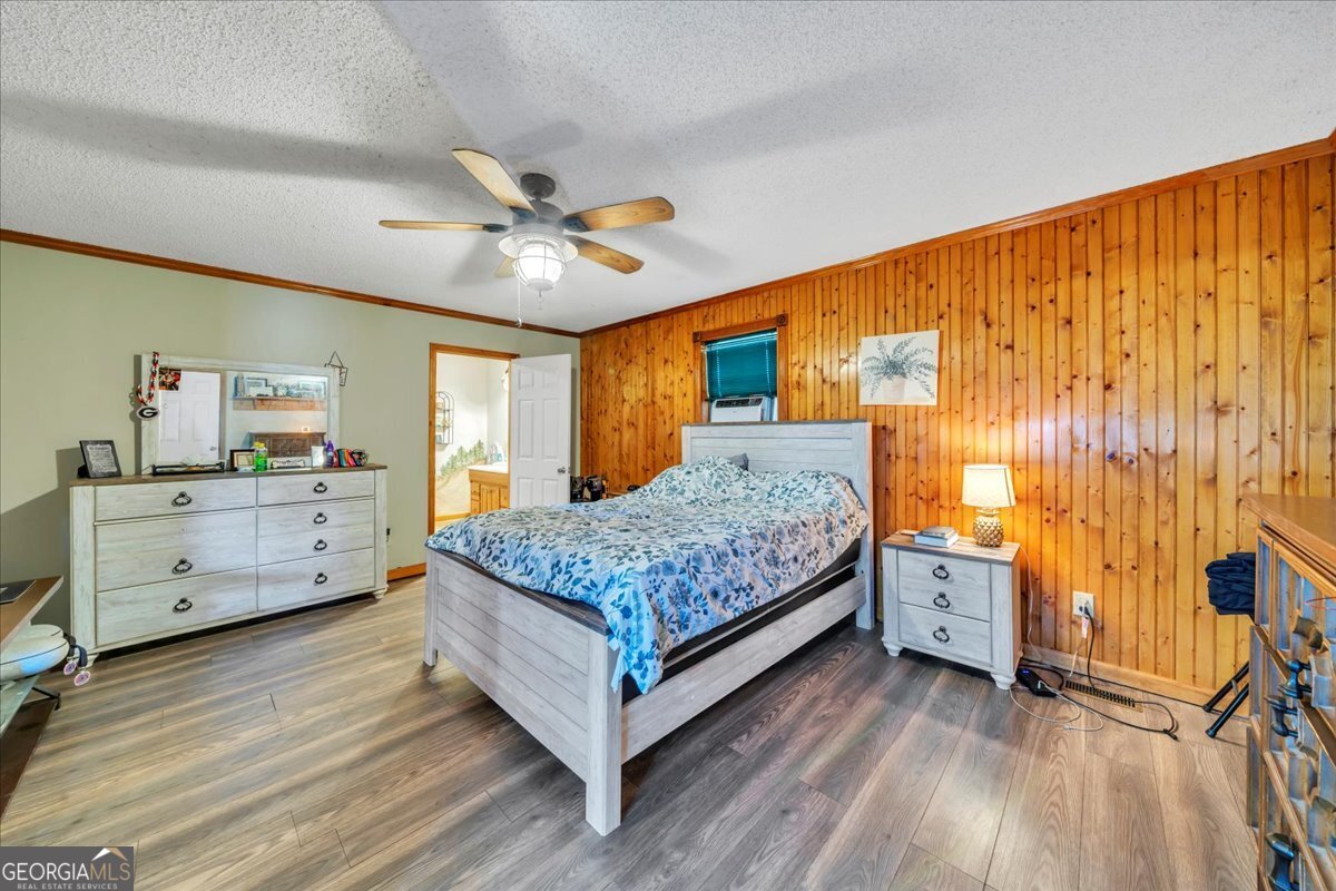 874 Mistletoe Road Abbeville, GA 31001 - Photo 24 of 67 a bedroom with a bed and a dresser