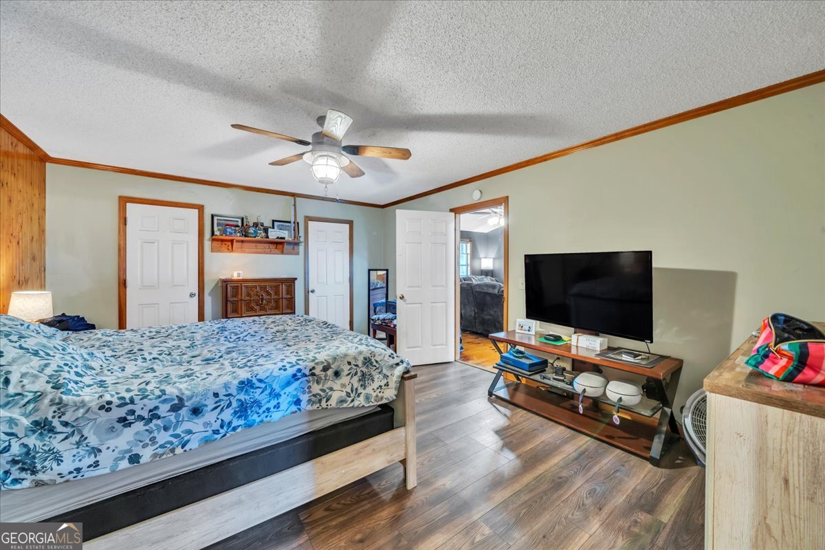 874 Mistletoe Road Abbeville, GA 31001 - Photo 29 of 67 a bedroom with a bed and a flat screen tv