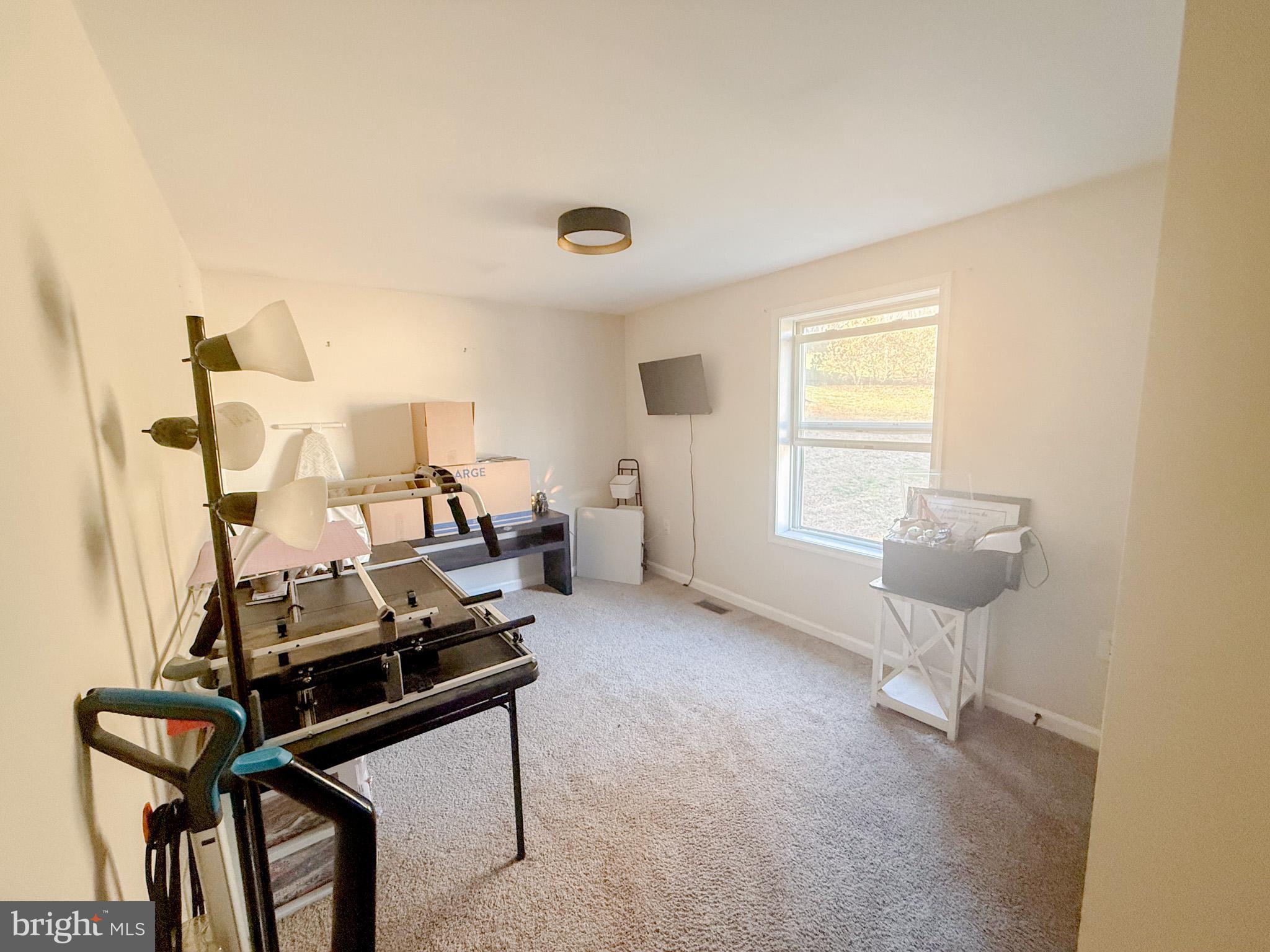 77 Martin Road Conowingo, MD 21918 - Photo 11 of 24 a view of a room with gym equipment