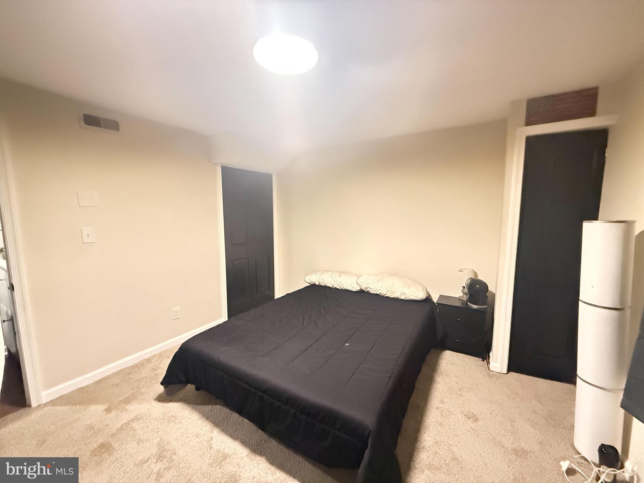 77 Martin Road Conowingo, MD 21918 - Photo 17 of 24 a bedroom with a bed and a cabinet