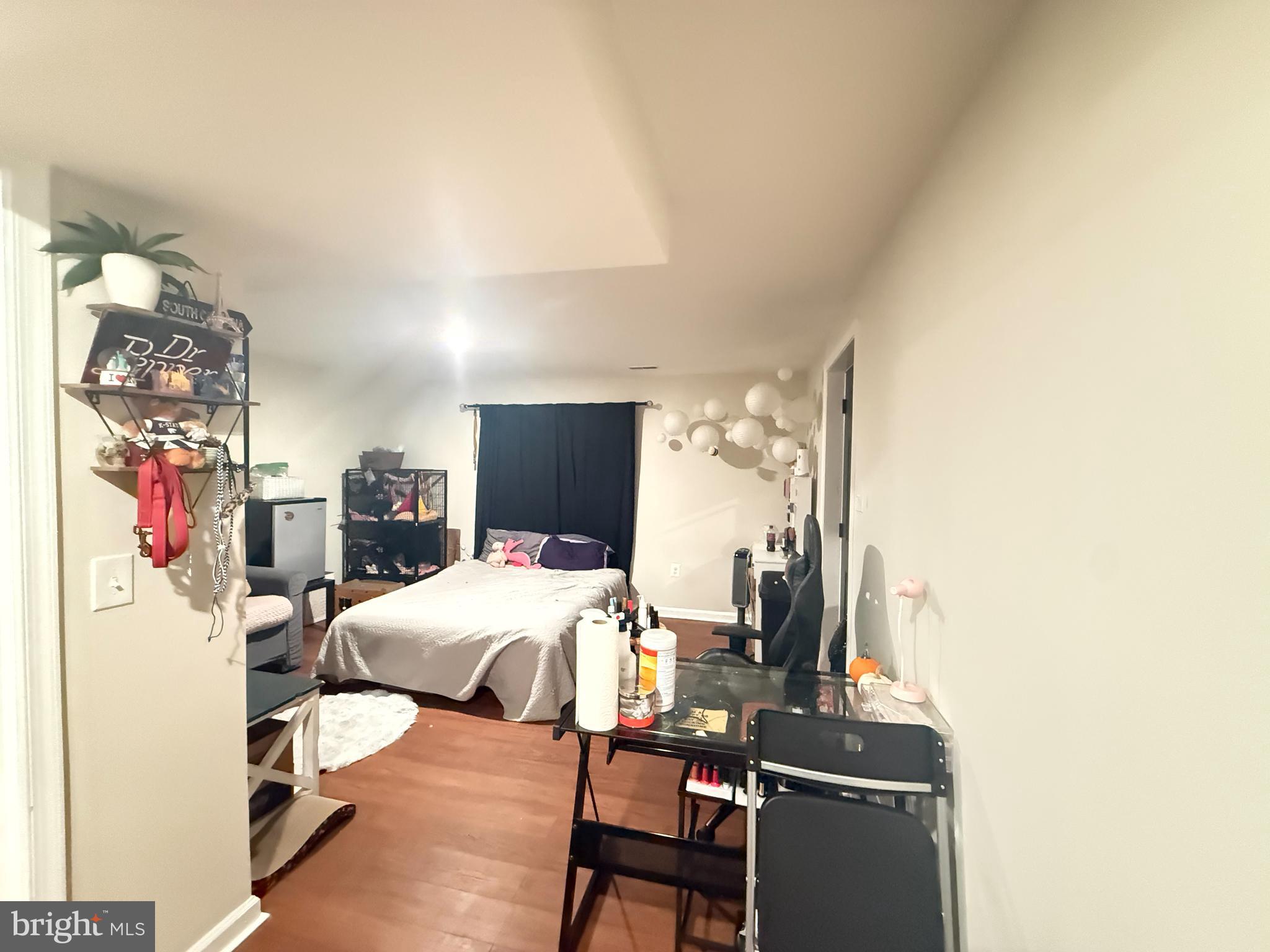 77 Martin Road Conowingo, MD 21918 - Photo 19 of 24 a bedroom with a bed and a flat screen tv