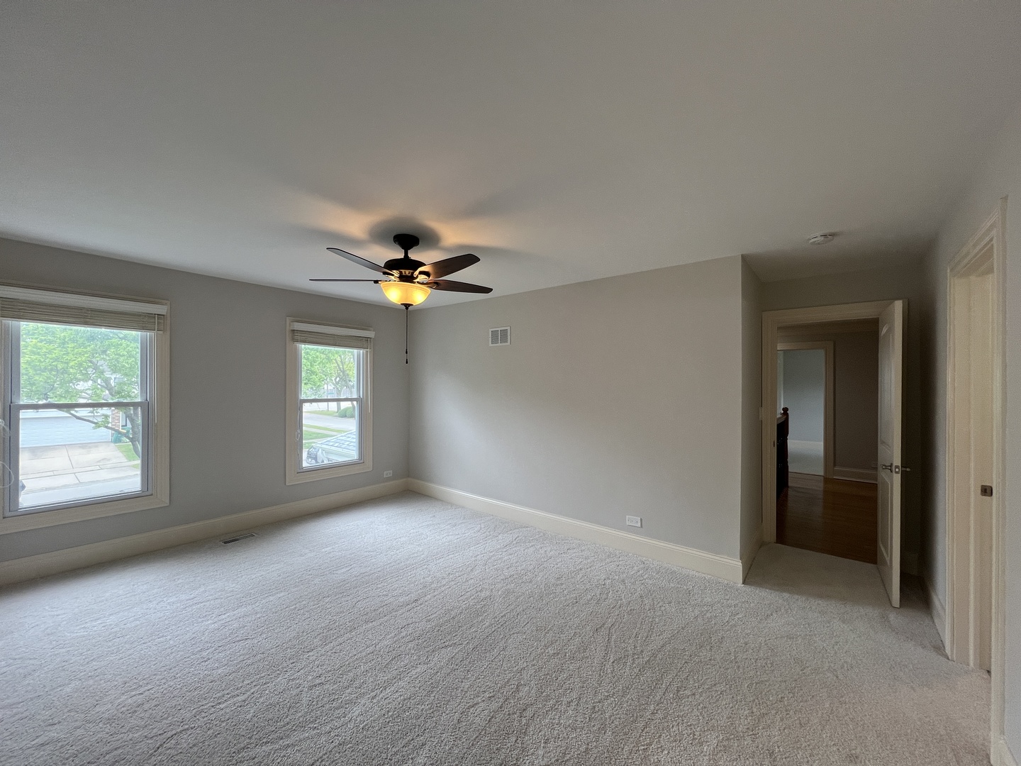 1108 Devonshire Road Buffalo Grove, IL 60089 - Photo 13 of 22 an empty room with windows and fan