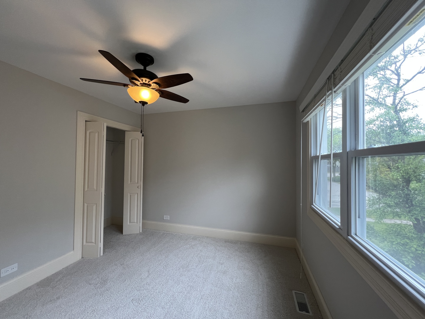 1108 Devonshire Road Buffalo Grove, IL 60089 - Photo 17 of 22 a view of an empty room with a window