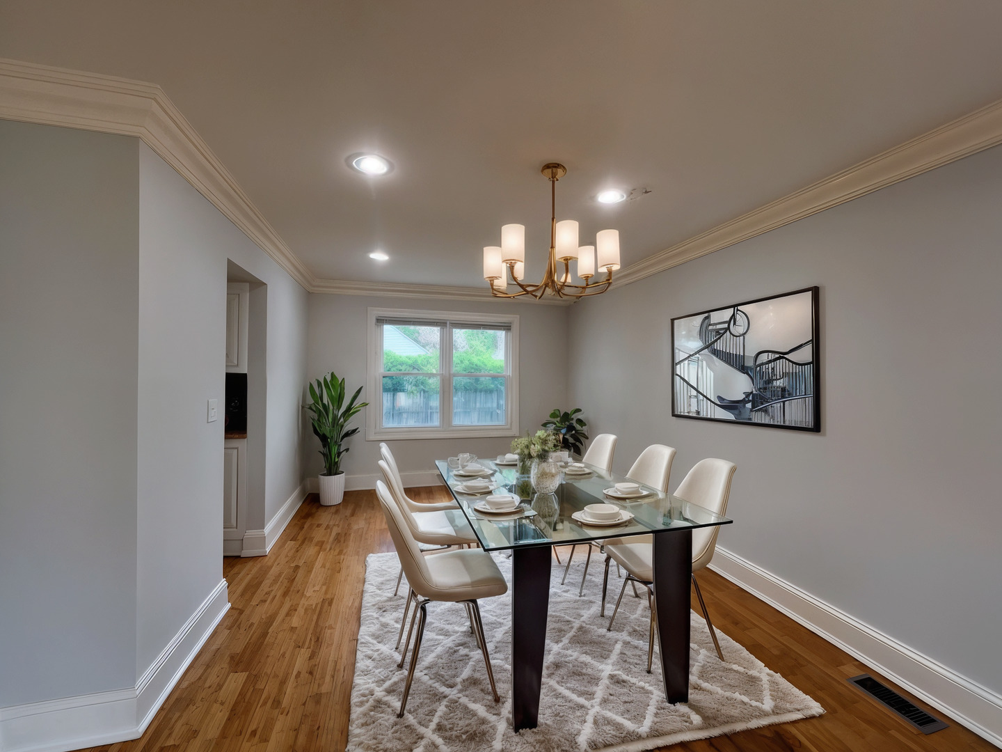 1108 Devonshire Road Buffalo Grove, IL 60089 - Photo 3 of 22 a view of a dining room with furniture and a chandelier