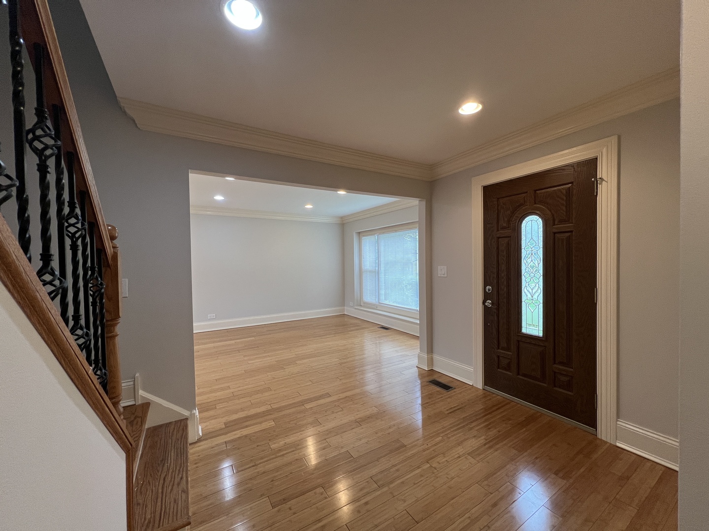 1108 Devonshire Road Buffalo Grove, IL 60089 - Photo 9 of 22 a view of an empty room with wooden floor and a window