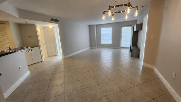 a view of a bathroom with a sink and a mirror