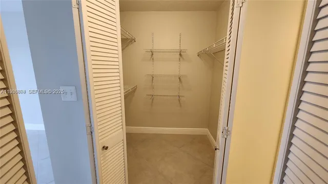 a bathroom with a glass door shower and a sink