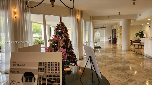 a view of a living room and a balcony