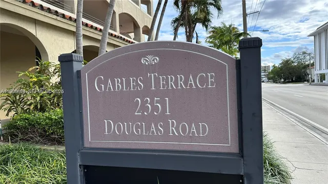 a sign that is on a pole on the street