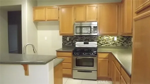 a kitchen with a stove and a sink
