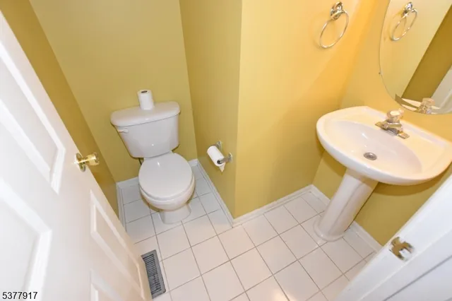 a bathroom with a toilet and a sink