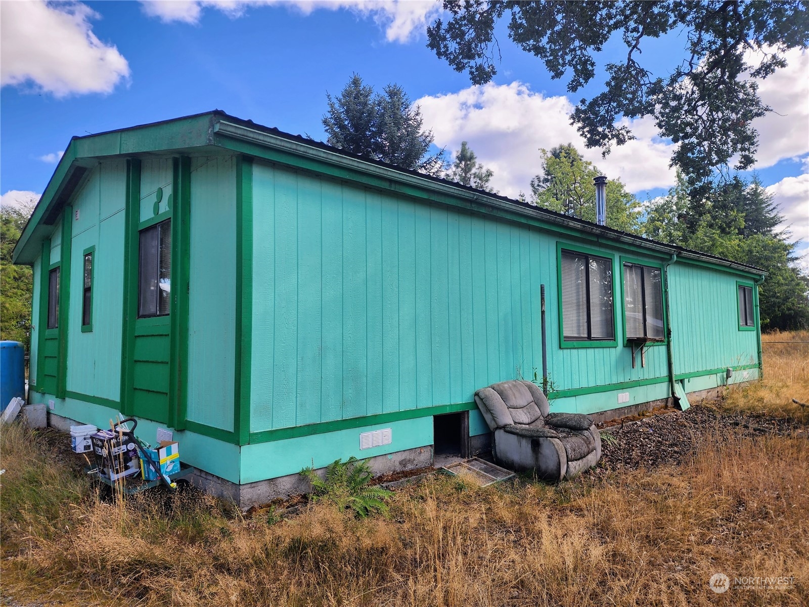 936 Tucker Road Toledo, WA 98591 - Photo 5 of 34 a backyard of a house with table and chairs