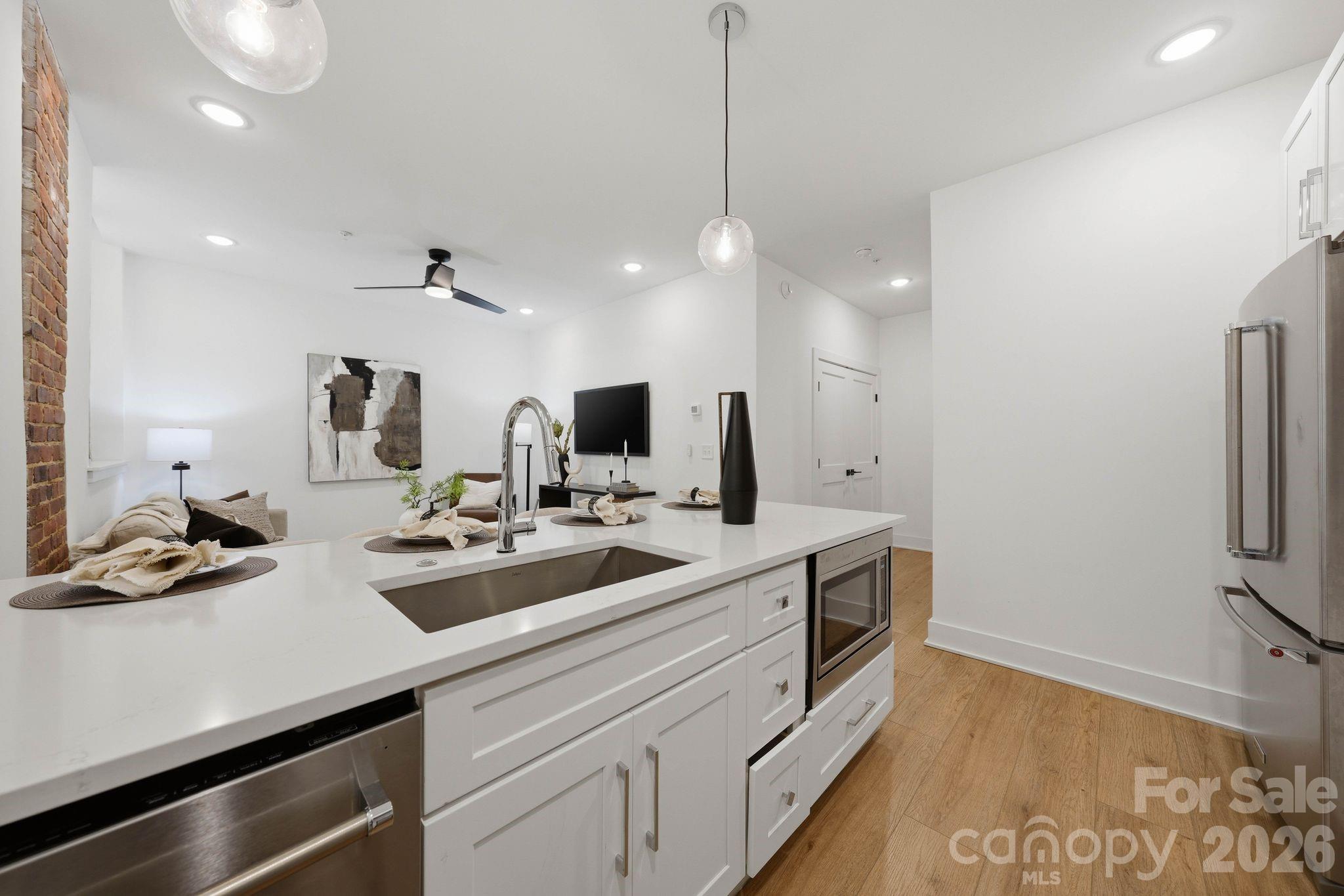 201 Grandin Road, Unit 13 Charlotte, NC 28208 - Photo 11 of 46 a kitchen with sink refrigerator and stove