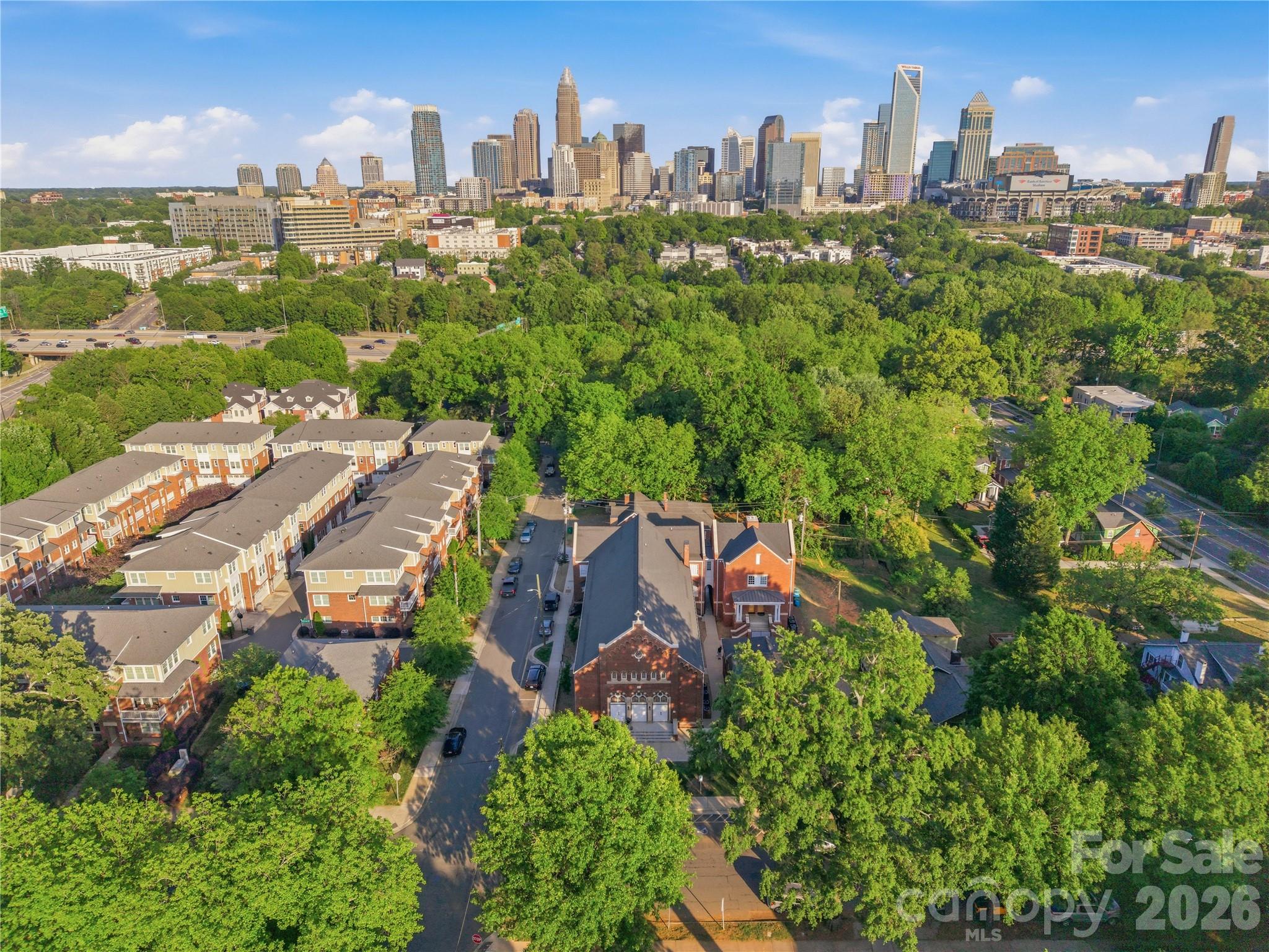201 Grandin Road, Unit 13 Charlotte, NC 28208 - Photo 34 of 46 an aerial view of a city with lots of residential buildings
