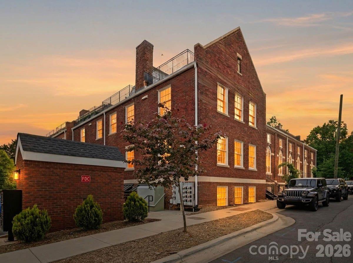 201 Grandin Road, Unit 13 Charlotte, NC 28208 - Photo 5 of 46 a front view of a house with a yard