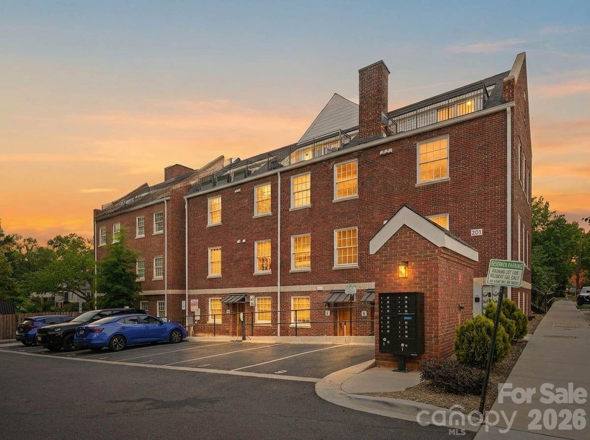 201 Grandin Road, Unit 13 Charlotte, NC 28208 - Photo 6 of 46 a front view of a house with a garden