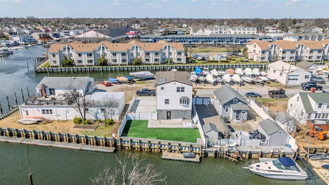 a view of a lake with a building swimming pool and outdoor space