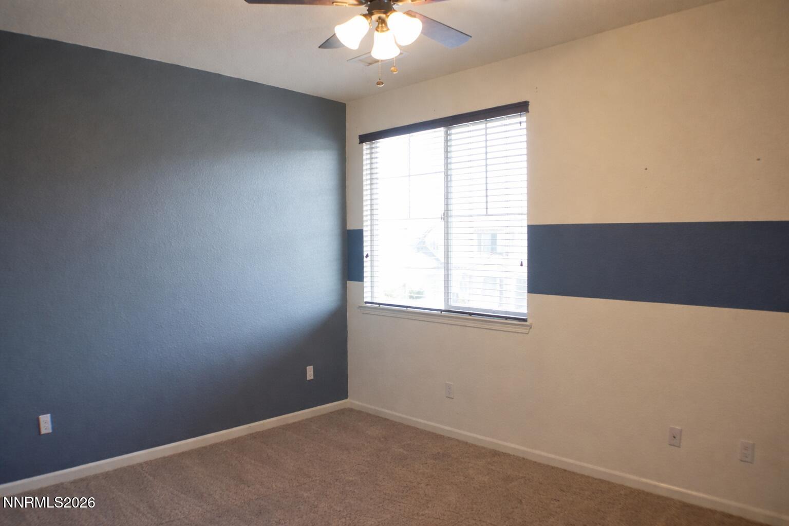 10855 Pebble Hill Drive Reno, NV 89521 - Photo 17 of 27 an empty room with a window