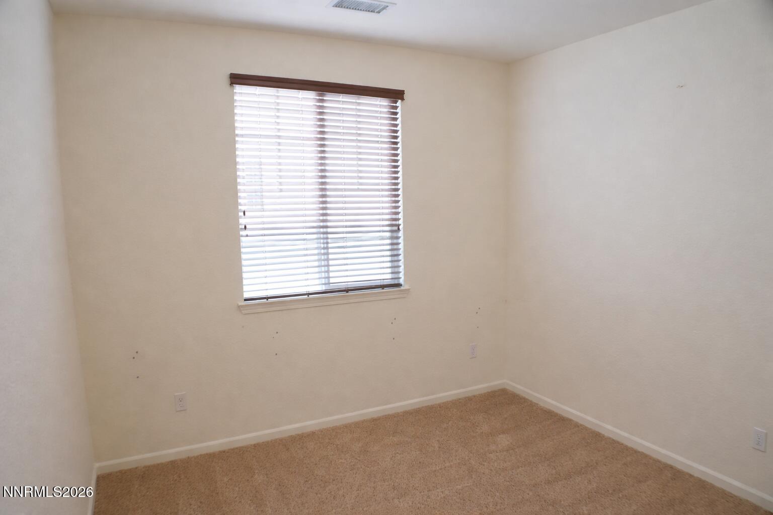 10855 Pebble Hill Drive Reno, NV 89521 - Photo 18 of 27 an empty room with a window