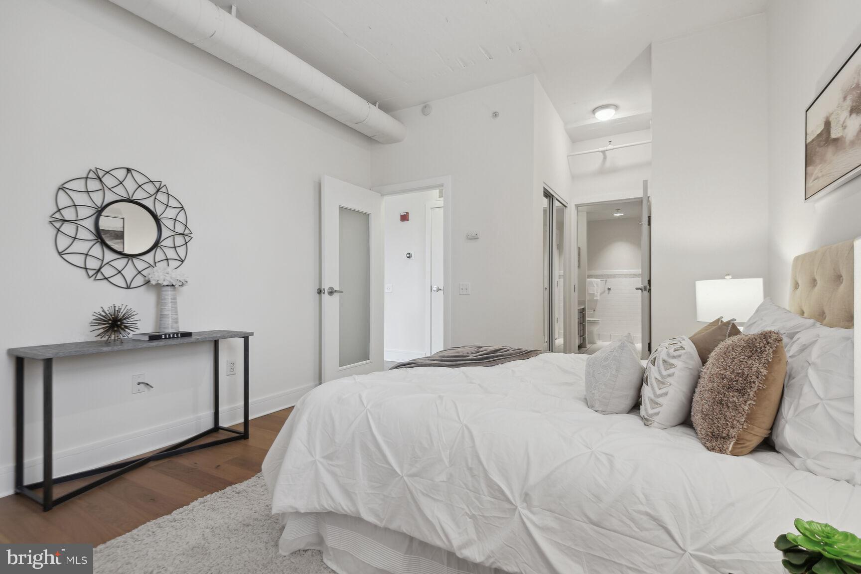 809 6th Street Northwest, Unit 65 Washington, DC 20001 - Photo 12 of 21 a bedroom with a bed and cabinets