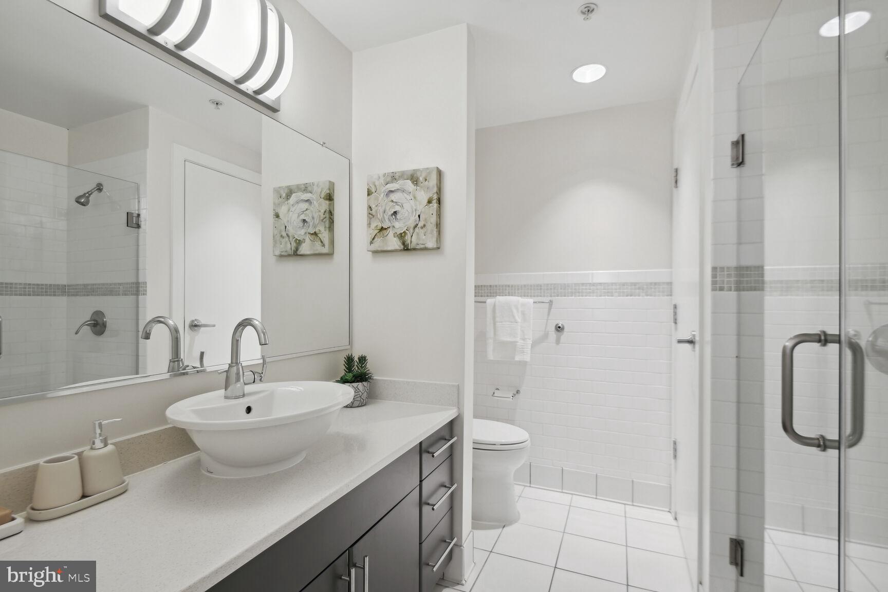 809 6th Street Northwest, Unit 65 Washington, DC 20001 - Photo 13 of 21 a bathroom with a sink toilet and shower