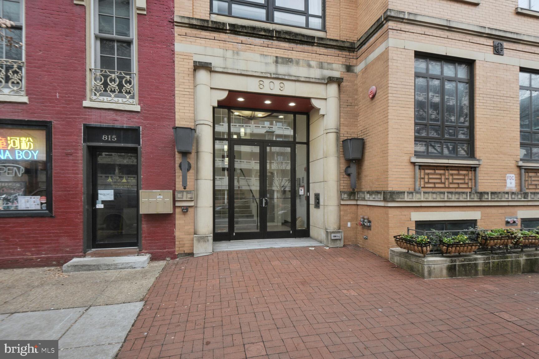 809 6th Street Northwest, Unit 65 Washington, DC 20001 - Photo 20 of 21 a view of a brick building with a bench in front of building