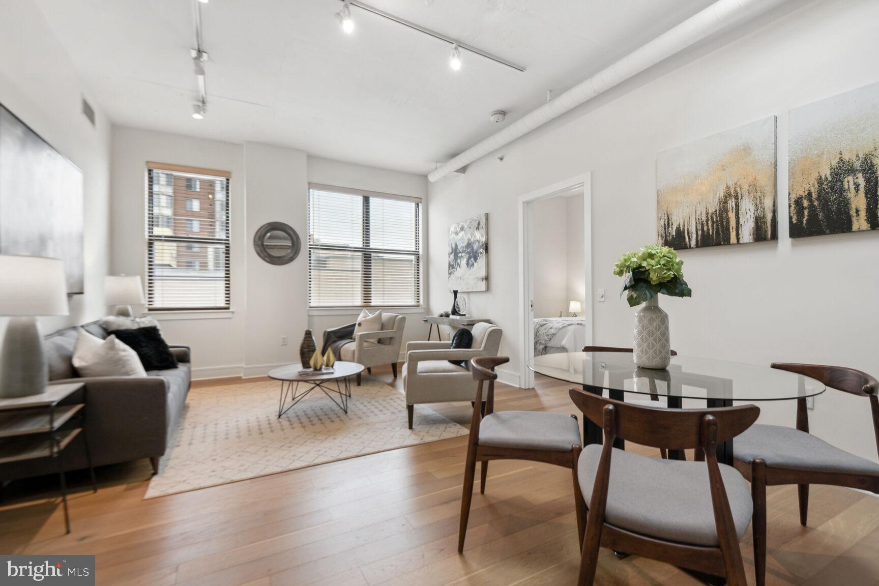 809 6th Street Northwest, Unit 65 Washington, DC 20001 - Photo 5 of 21 a living room with furniture and wooden floor