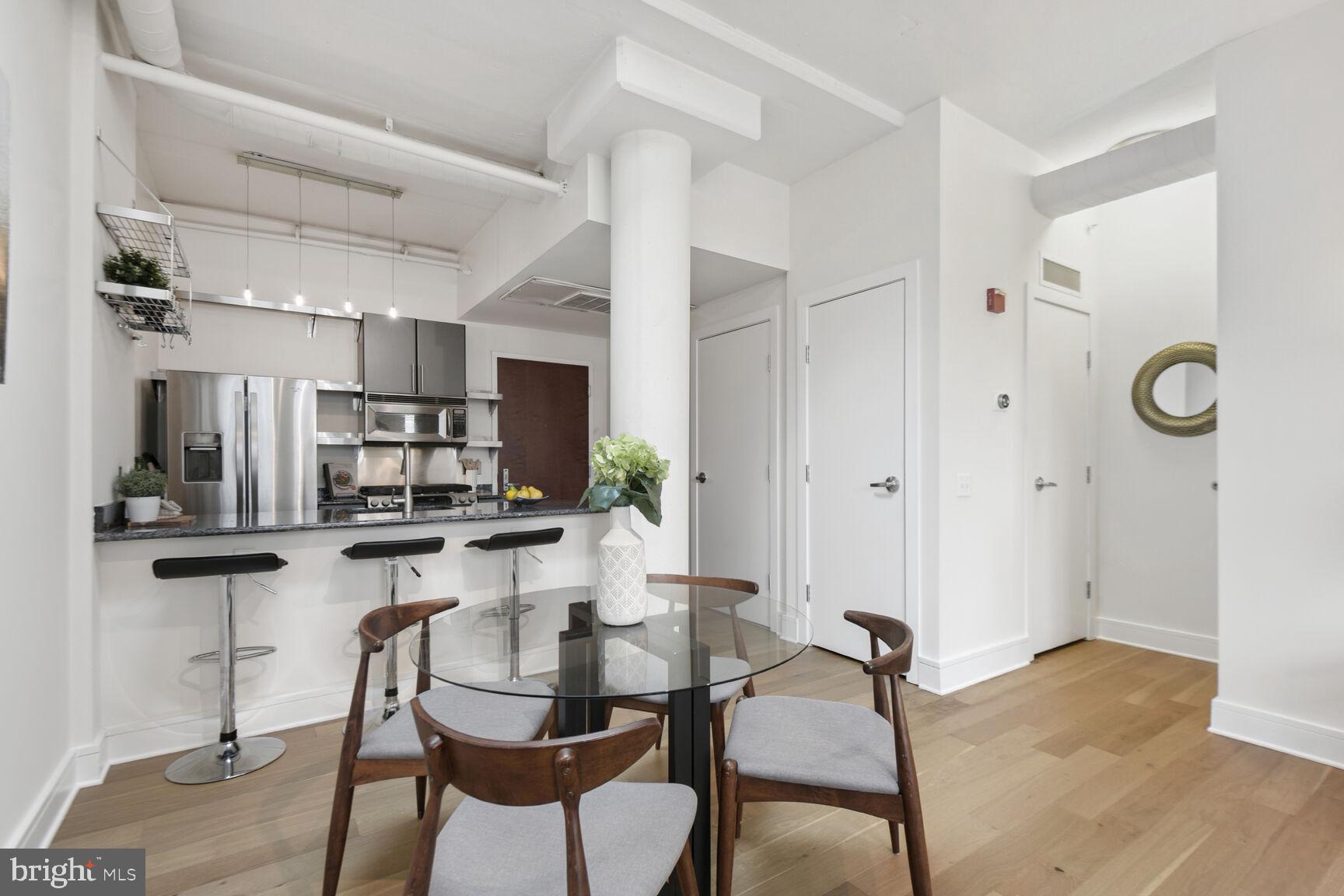 809 6th Street Northwest, Unit 65 Washington, DC 20001 - Photo 6 of 21 a dining room with furniture and kitchen view