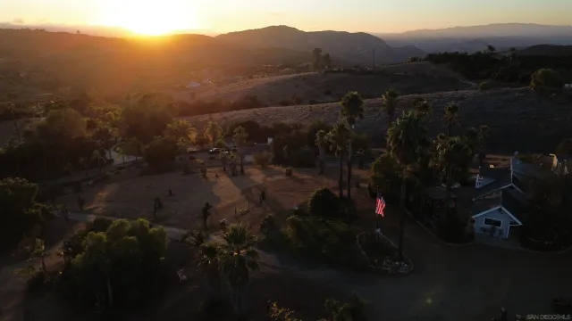 a bathroom with a sink a mirror and shower