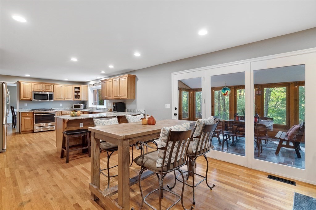 10 Fieldstone Way Boxford, MA 01921 - Photo 13 of 42 a view of a dining room with furniture window and wooden floor
