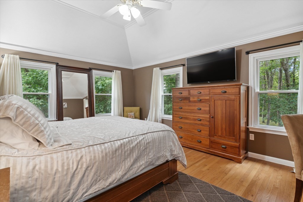 10 Fieldstone Way Boxford, MA 01921 - Photo 22 of 42 a bedroom with a large bed and flat tv screen